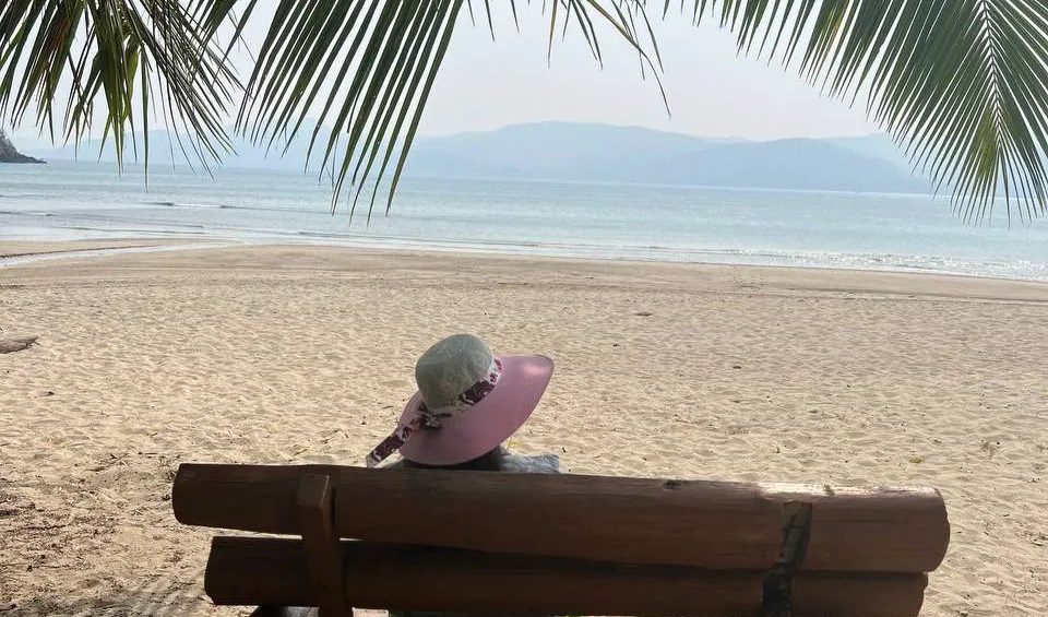 A girl sitting at chidiya tapu beach and enjoying the view