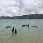 People performing scuba diving in the beach of North bay which is a famous place in Port Blair city