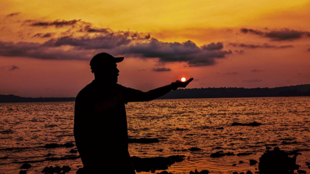 A traveler witnessing the sunset in Andaman in April which is considered one of the best month to visit Andaman