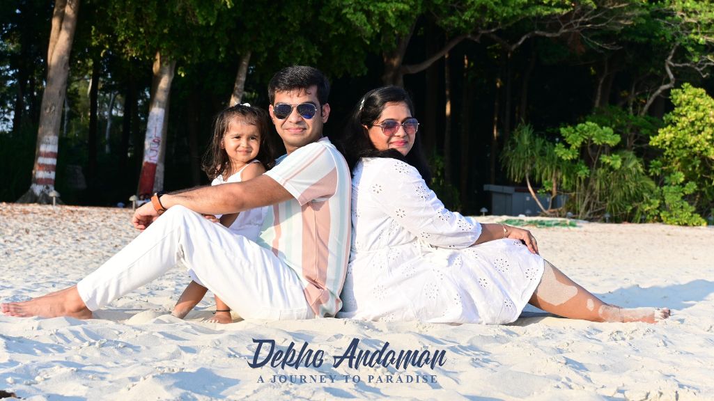 A family sitting in the beach of Havelock Island