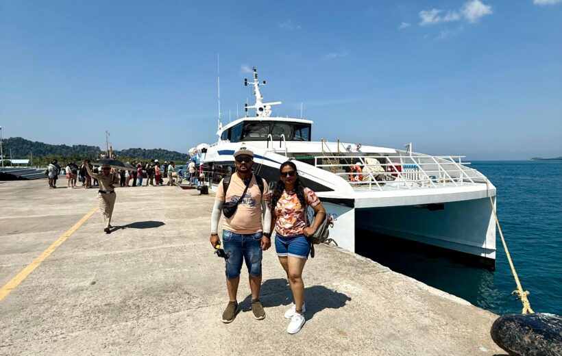 A couple standing in front of ITT Majestic Ferry